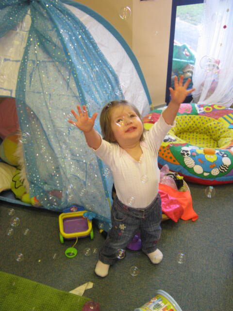 Spirituality and Play Toddler With Arms Outstretched